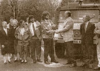 Klaus Noelke, the honorary German consul in Kerry, presents the keys of the Mercedes Unimog to the Team in 1990. From left to right, Paul Walker, Maureen Chevins, Richard Stack, Maureen O'Reilly, Mary McGillycuddy, Mike Shea, Con Moriarty, Klaus Noelke, Gerry Moore, Louis O'Toole, Tim Murphy.