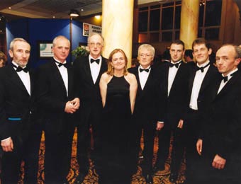 Team members Tim Long, Jimmy Laide, Tim Murphy, Marguerite Brosnan, Christy McCarthy, Larry Madden, Mike Sandover and Mike Long at the 1999 presentation of a prestigious 'Kerryman' Community Merit Award.