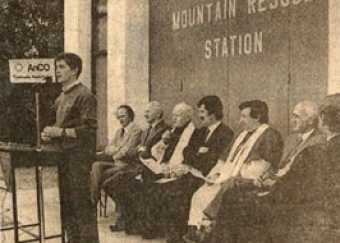 The opening of the country's first dedicated Mountain Rescue station, 1983. Sean Ó'Suilleabháin, team leader, is speaking. Seated are Tom Arthur, Canon Matt Keane, the Killorglin Parish Priest, An Tánaiste Dick Spring, Bishop Empey, and County Manager T.F. Collins.